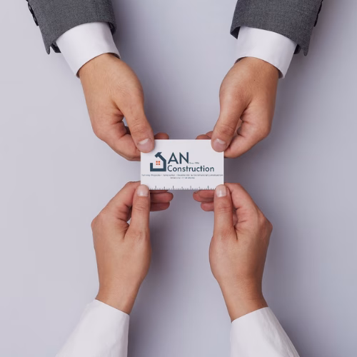 Professional business card design for AN Construction featuring logo, contact details, and minimalist layout